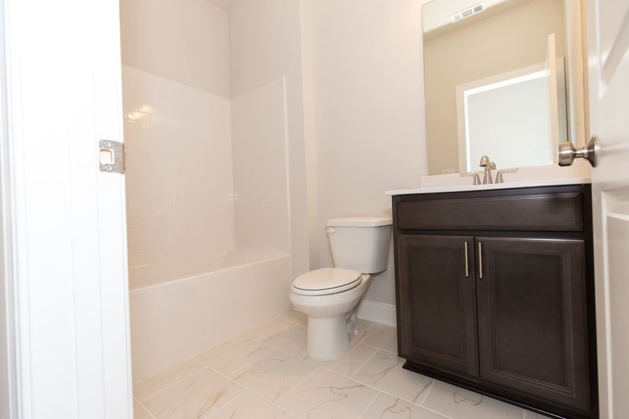Representative furnished interior of a home built from the The Owens by The Providence Group in Waterhaven, Cumming (Image 19).