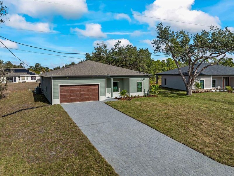 Front exterior of a new home in , North Port, FL, highlighting curb appeal (Image 27).