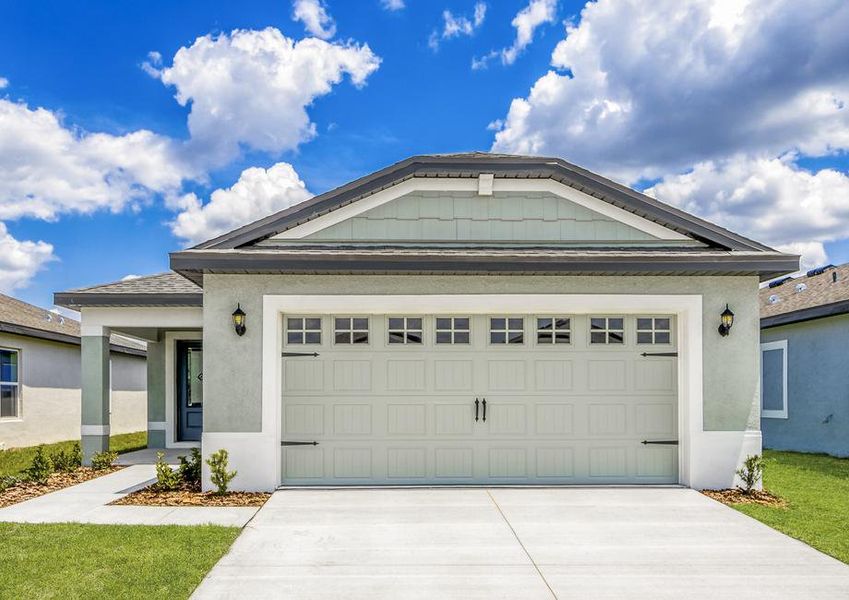 The exterior of the two-car garage Cypress with a sidewalk the leads to the covered porch