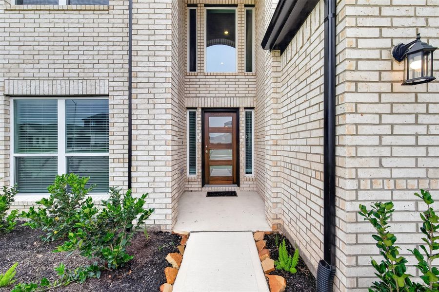 Exterior details and patio area of a home in Sunterra, Katy (Image 3).