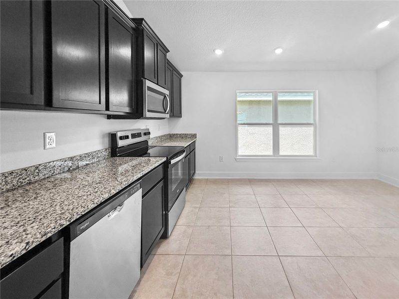 Furnished interior view inside a new home in Harmony Central, St. Cloud (Image 6).