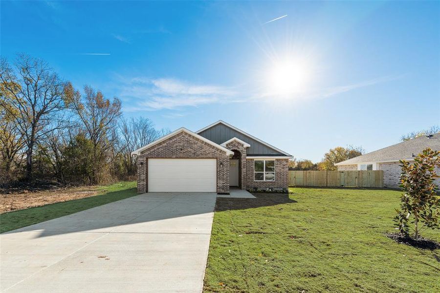 Front exterior of a new home in , Forney, TX, highlighting curb appeal (Image 21).