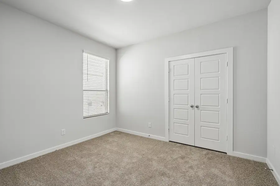 Bedroom in the Wimbledon home plan by Trophy Signature Homes