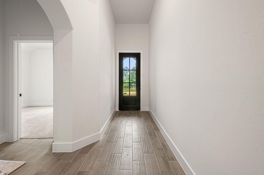 Another angle of entrance door and long foyer.