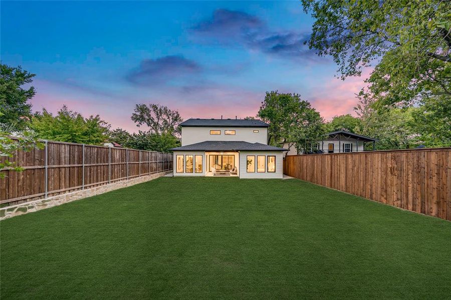 Back of house with a patio, a fenced backyard, and roof with shingles Back of house with a patio, a fenced backyard, and roof with shingles