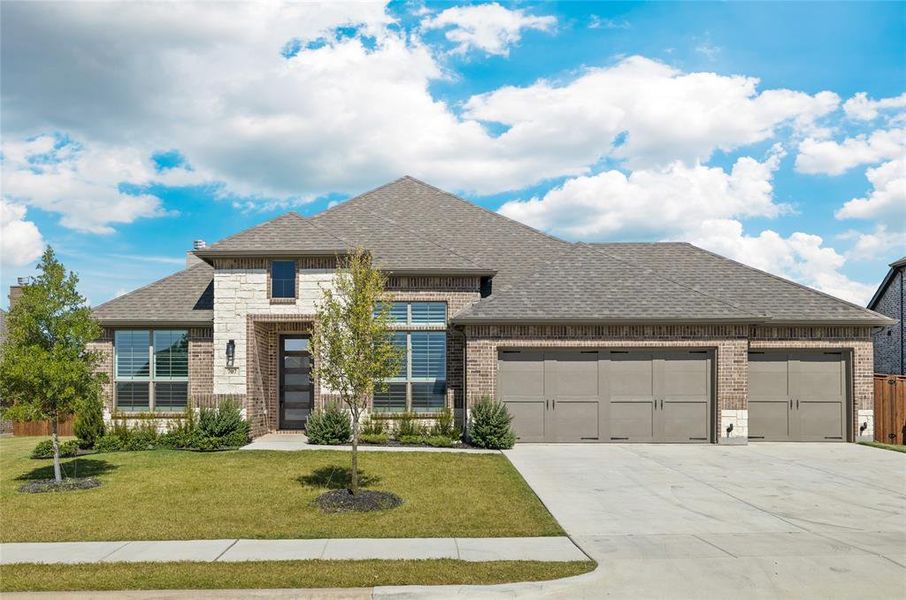 Front exterior of a new home in Lovers Landing, Forney, TX, highlighting curb appeal (Image 1).