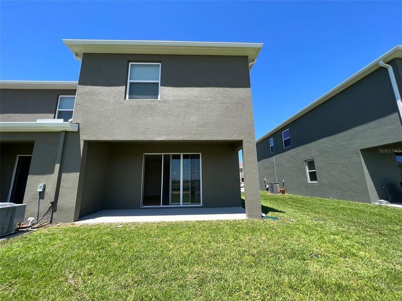 Front exterior of a new home in , Davenport, FL, highlighting curb appeal (Image 2).