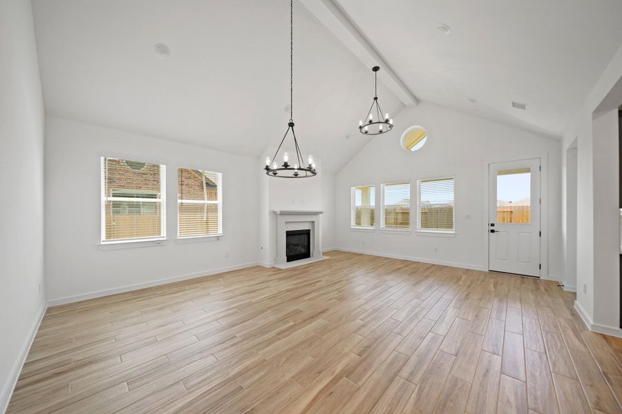 Open great room and dining area with vaulted ceilings (*Photo not of actual home and used for illustration purposes only.) Open great room and dining area with vaulted ceilings (*Photo not of actual home and used for illustration purposes only.)