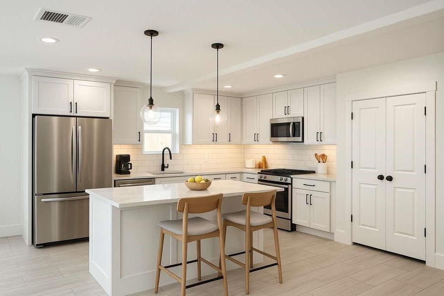 Staged- Elegant kitchen island with ambient under-cabinet lighting.