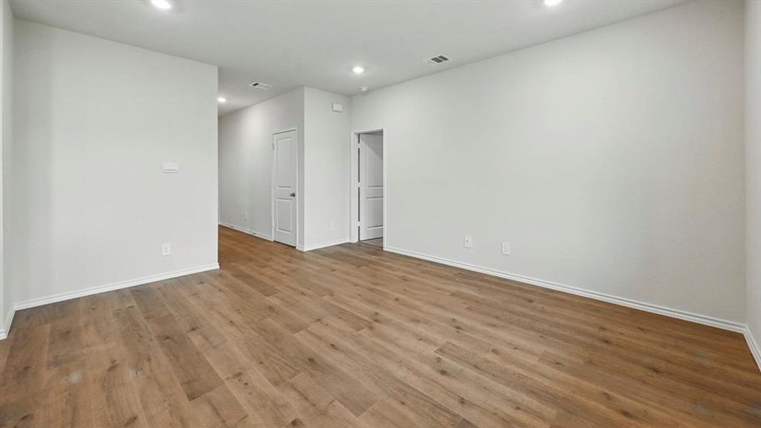 Unfurnished room with recessed lighting and dark wood-style flooring