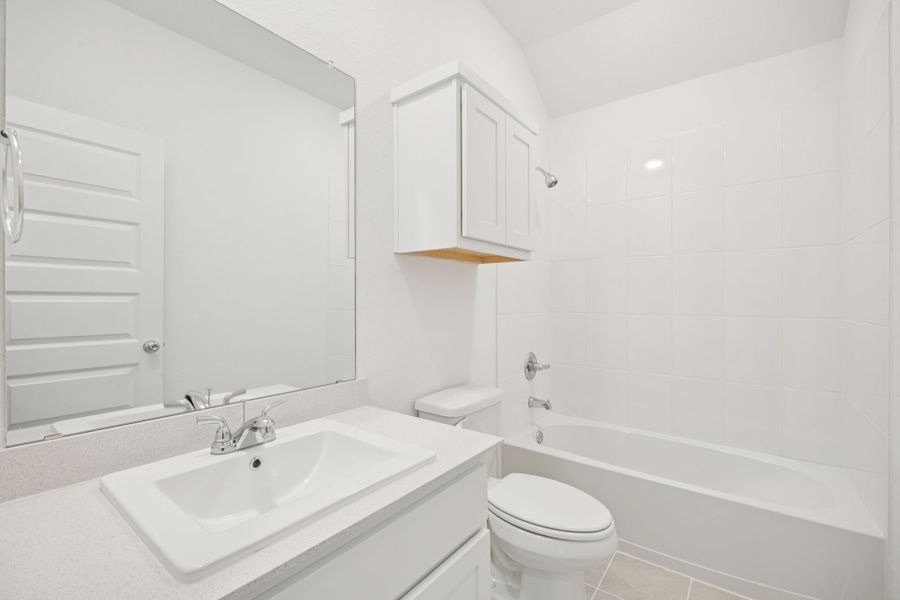 Bathroom in the Redbud home plan by Trophy Signature Homes - REPRESENTATIVE PHOTO