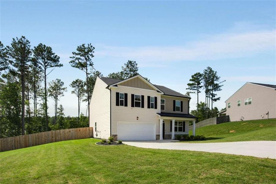 Front exterior of a new home in Stillwater Springs, Dacula, GA, highlighting curb appeal (Image 2). Front exterior of a new home in Stillwater Springs, Dacula, GA, highlighting curb appeal (Image 2).