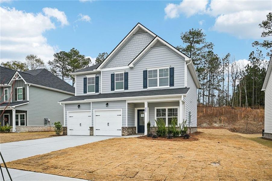 Front exterior of a new home in The Hills at Cedar Creek, Winder, GA, highlighting curb appeal (Image 22).