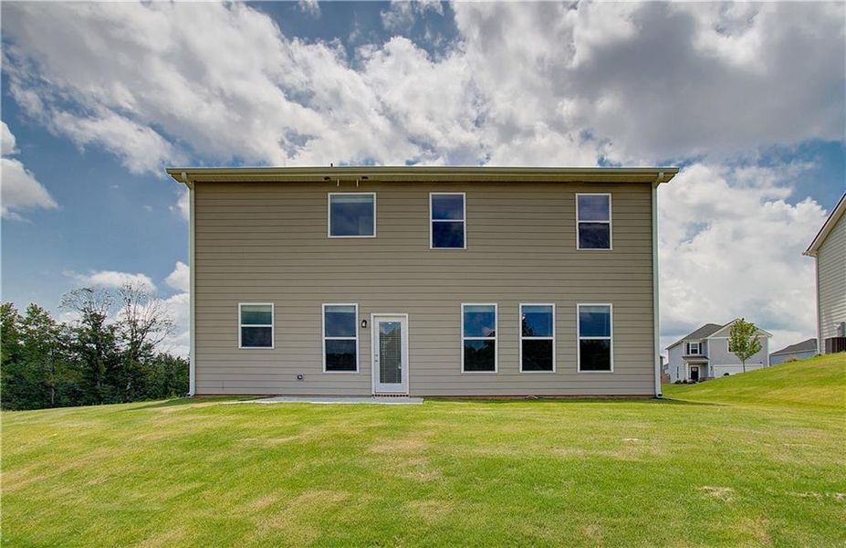 Front exterior of a new home in Chapel Hill, Newnan, GA, highlighting curb appeal (Image 1). Front exterior of a new home in Chapel Hill, Newnan, GA, highlighting curb appeal (Image 1).