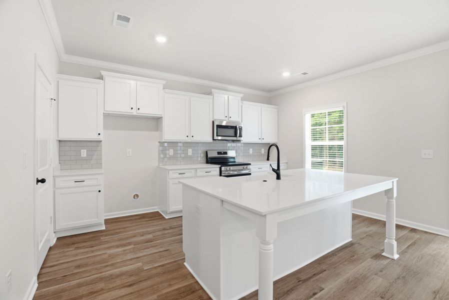 Representative furnished interior of a home built from the Loblolly Select N by McGuinn Homes in Broadway Lake, Anderson (Image 8). Representative furnished interior of a home built from the Loblolly Select N by McGuinn Homes in Broadway Lake, Anderson (Image 8).