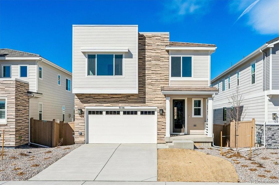 Front exterior of a new home in The Summit at Meridian, Englewood, CO, highlighting curb appeal (Image 1). Front exterior of a new home in The Summit at Meridian, Englewood, CO, highlighting curb appeal (Image 1).