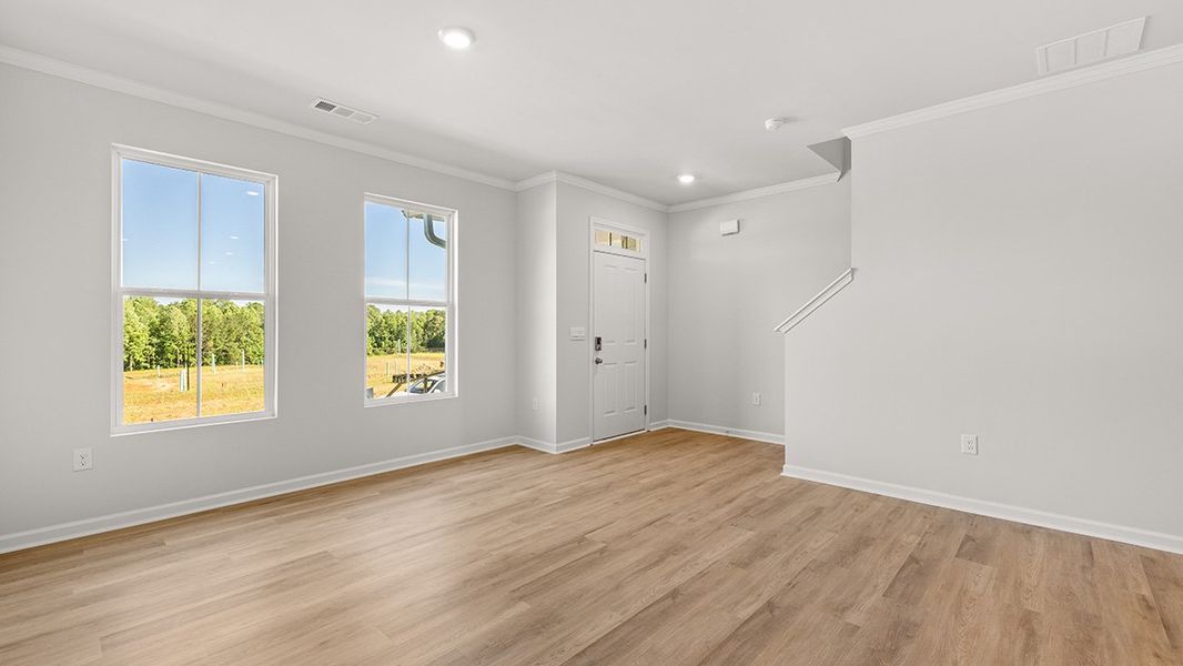 Representative unfurnished interior of a home built from the AMESBURY by D.R. Horton in Waypoint, Flowery Branch (Image 14).