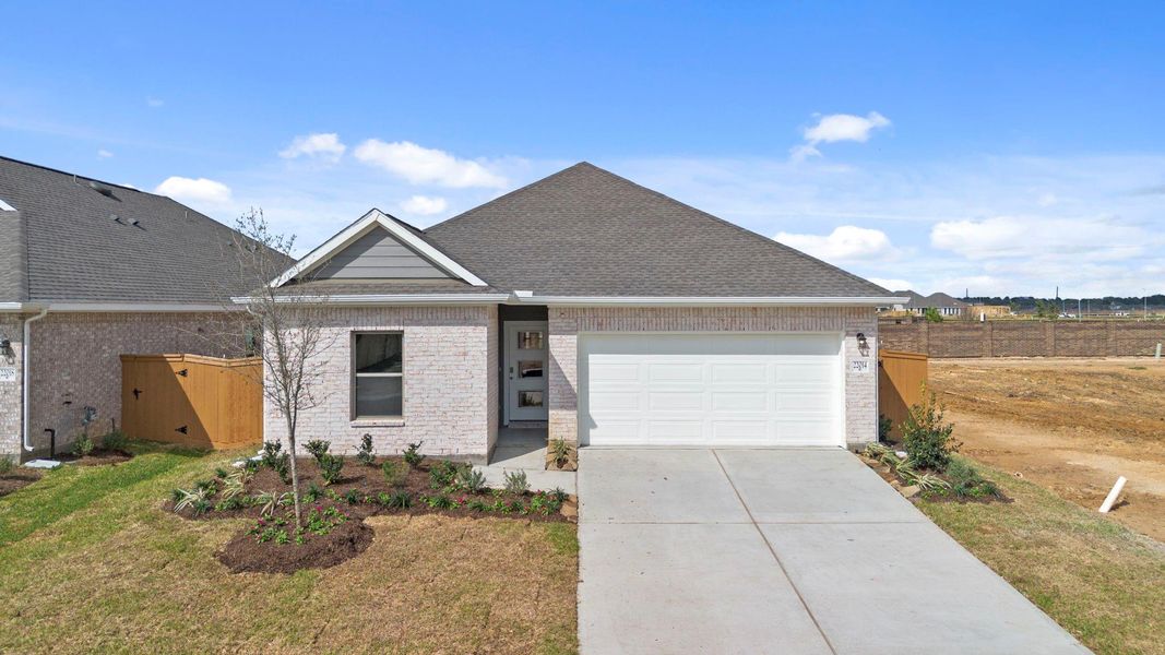 Front exterior of a new home in Cypress Green, Hockley, TX, highlighting curb appeal (Image 20). Front exterior of a new home in Cypress Green, Hockley, TX, highlighting curb appeal (Image 20).
