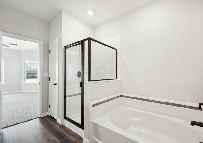 The master bath also features a soaking tub and walk-in shower.