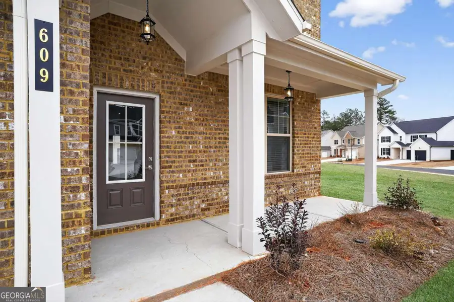 Exterior details and patio area of a home in The Fairways at Mirror Lake, Villa Rica (Image 3). Exterior details and patio area of a home in The Fairways at Mirror Lake, Villa Rica (Image 3).