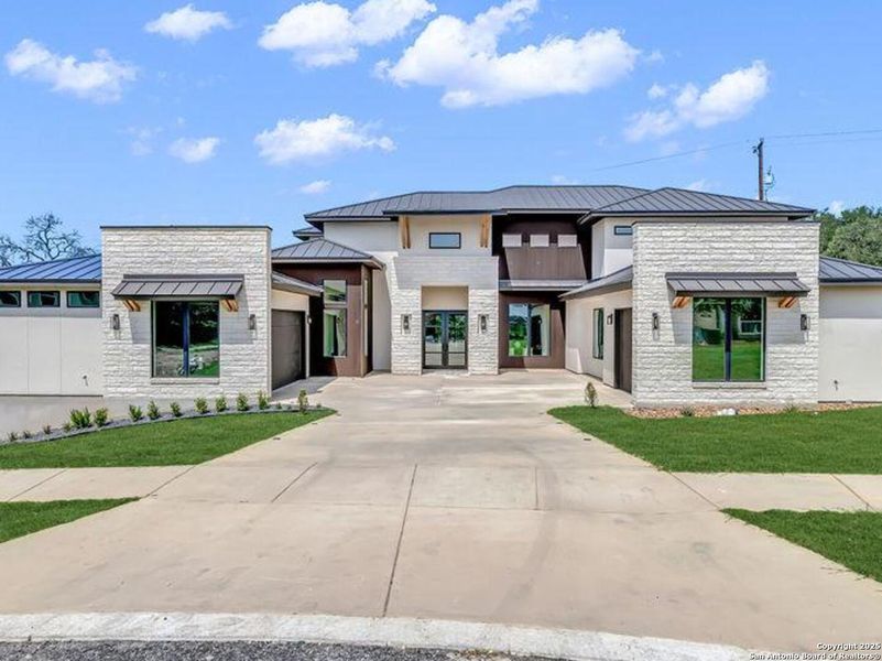 Front exterior of a new home in , San Antonio, TX, highlighting curb appeal (Image 1). Front exterior of a new home in , San Antonio, TX, highlighting curb appeal (Image 1).