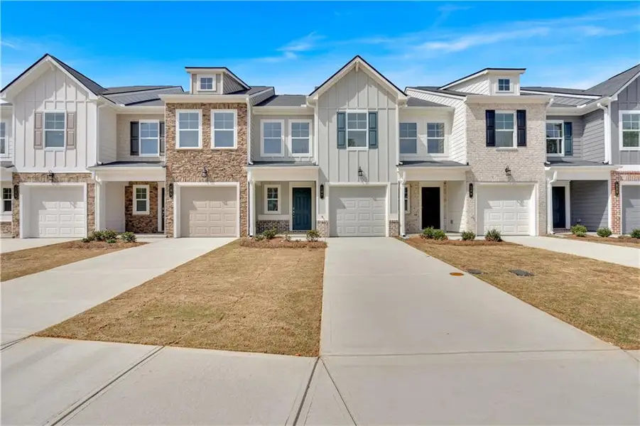 Front exterior of a home in the Village Green community, located in Adairsville, GA (Image 1).