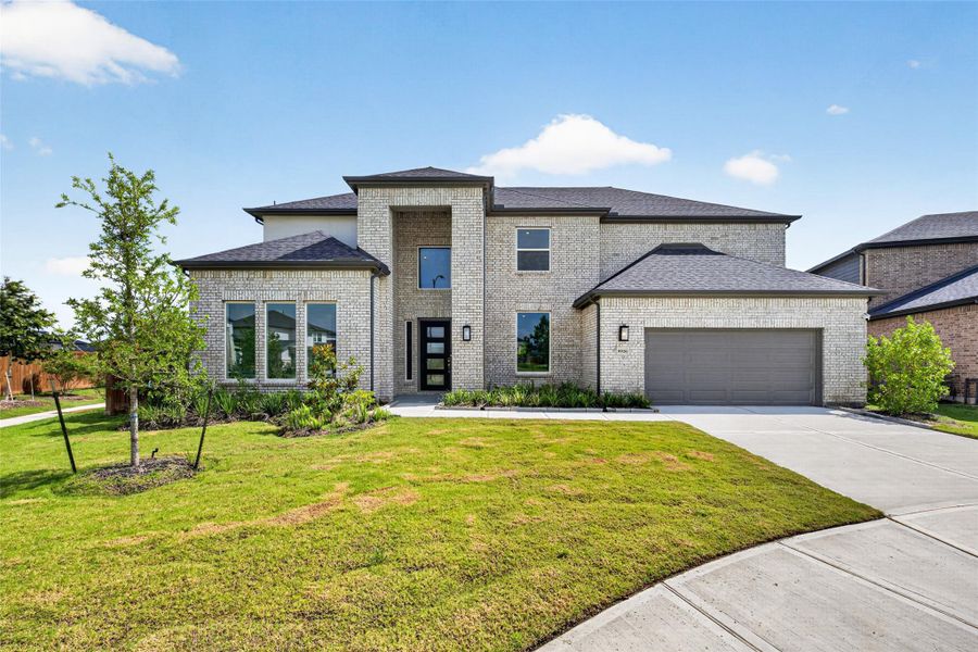 Front exterior of a new home in , Cypress, TX, highlighting curb appeal (Image 2). Front exterior of a new home in , Cypress, TX, highlighting curb appeal (Image 2).