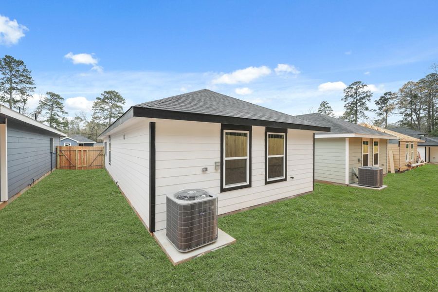 Exterior details and patio area of a home in William Trails, Willis (Image 11). Exterior details and patio area of a home in William Trails, Willis (Image 11).