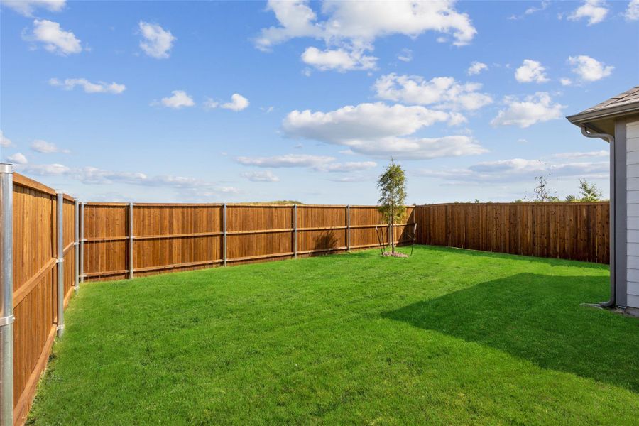 Exterior details and patio area of a home in Trinity Ranch, Elgin (Image 2).