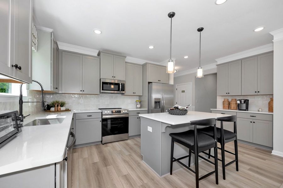 Representative furnished interior of a home built from the The Hampton by Smith Douglas Homes in La Segarra, Brookshire (Image 10).