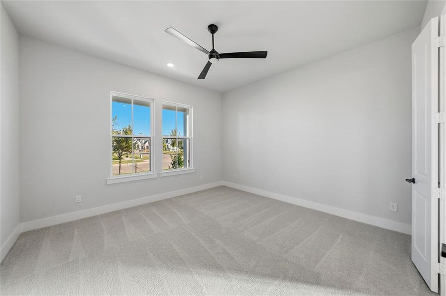 Spare room with light colored carpet, a ceiling fan, and recessed lighting