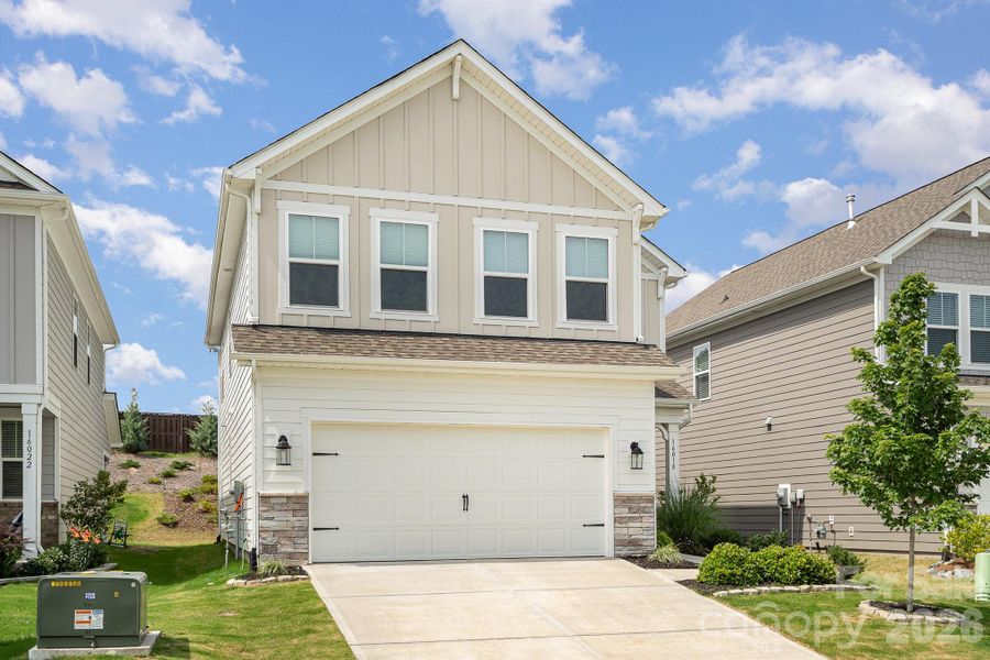Front exterior of a new home in Village at North Reach, Charlotte, NC, highlighting curb appeal (Image 23).