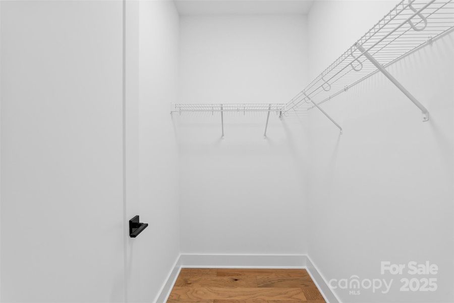 Primary Walk-In Closet Primary Walk-In Closet