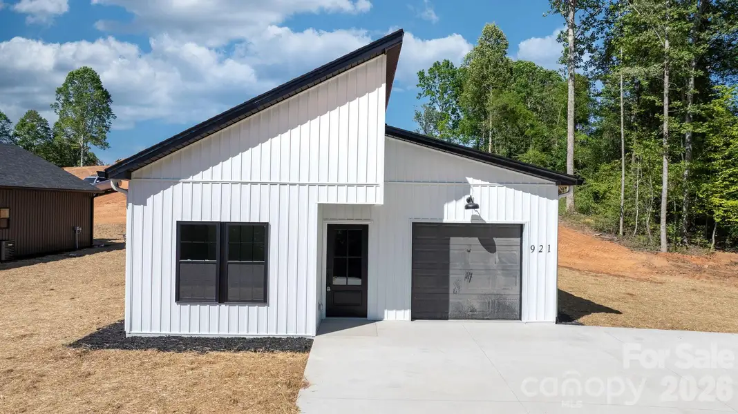 Front exterior of a new home in , Lenoir, NC, highlighting curb appeal (Image 17).