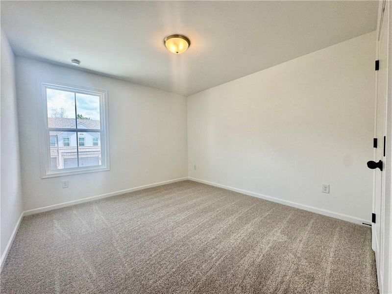 Spacious, unfurnished interior of a new home in Eastlyn Crossing, Flowery Branch (Image 25).