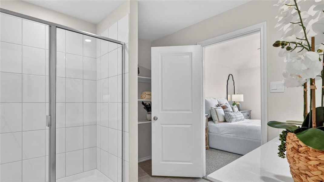 Glass-enclosed shower with white subway tile surround, featuring a built-in shelf alcove Glass-enclosed shower with white subway tile surround, featuring a built-in shelf alcove