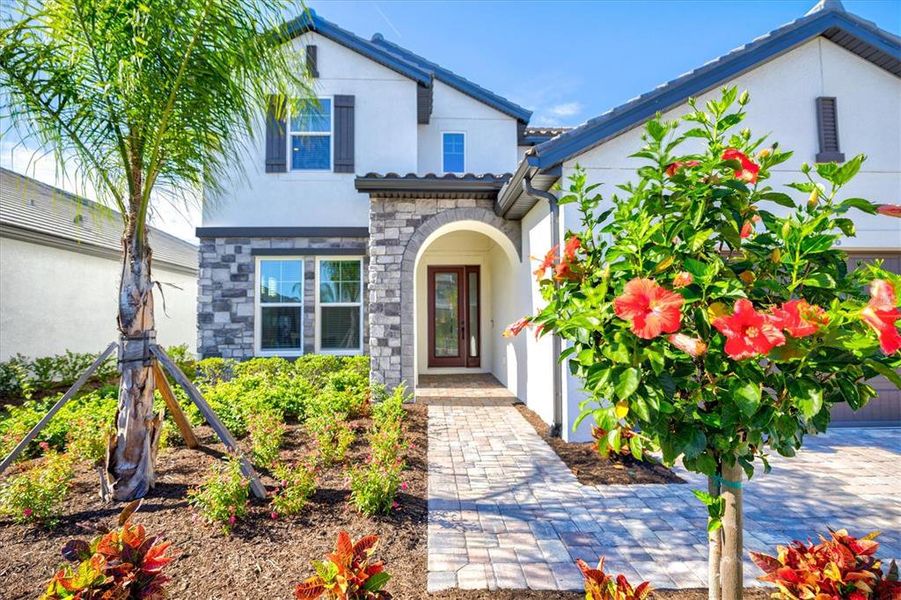 Front exterior of a new home in , Bradenton, FL, highlighting curb appeal (Image 24).