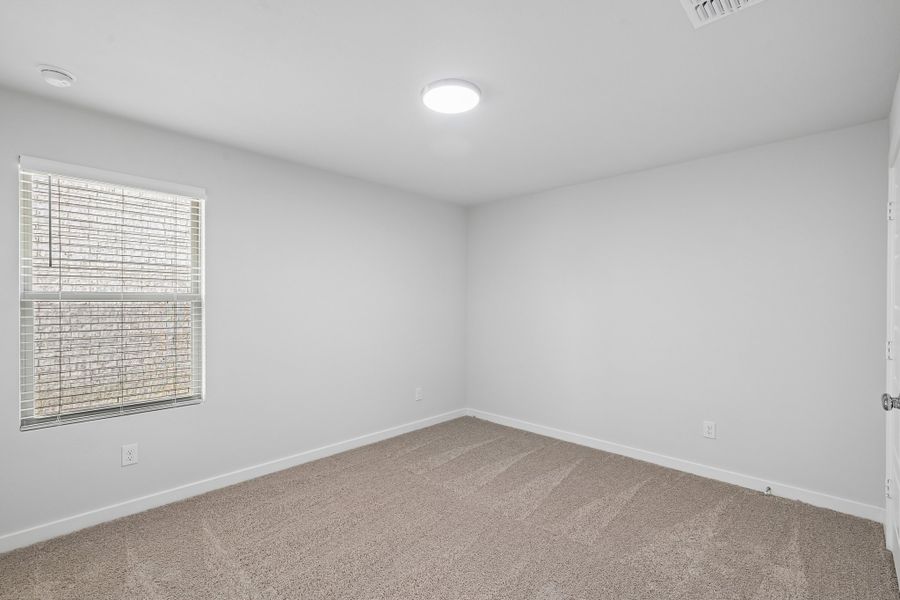 Bedroom in the Hayden home plan by Trophy Signature Homes
