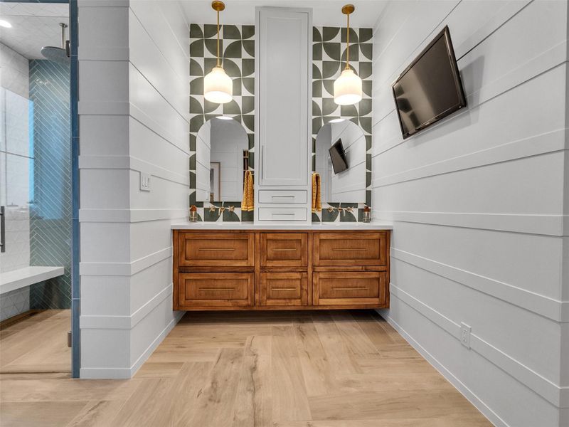 Another angle of the elegant primary bathroom reveals dual vanities with custom drawers, designer fixtures, and generous counter space that combine practicality with beauty. Across the room, a spacious glass-enclosed shower provides a true spa experience, surrounded by premium finishes that echo the home’s refined coastal design. Every element was thoughtfully crafted to bring everyday luxury and lasting comfort to this serene retreat. Another angle of the elegant primary bathroom reveals dual vanities with custom drawers, designer fixtures, and generous counter space that combine practicality with beauty. Across the room, a spacious glass-enclosed shower provides a true spa experience, surrounded by premium finishes that echo the home’s refined coastal design. Every element was thoughtfully crafted to bring everyday luxury and lasting comfort to this serene retreat.