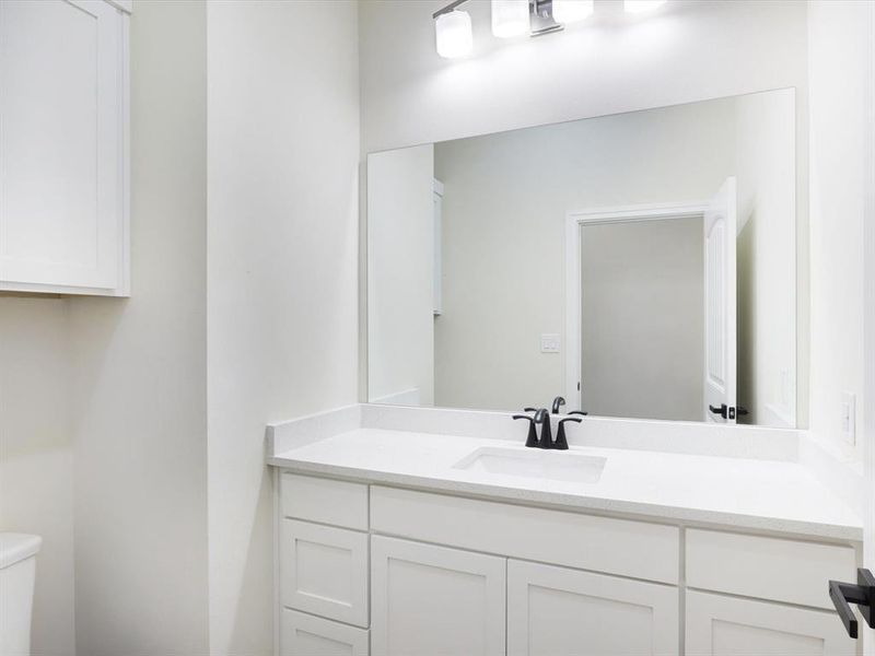 Bathroom featuring vanity and toilet Bathroom featuring vanity and toilet