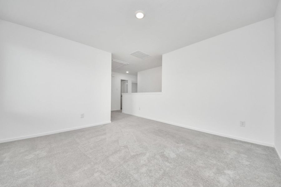 Spacious game room offering endless possibilities for entertainment.