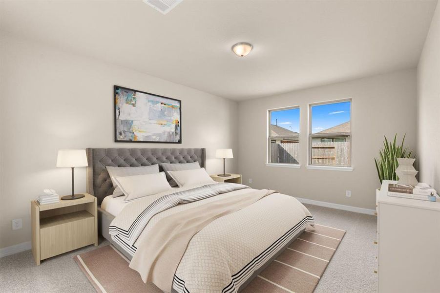 The primary bedroom is generously sized, creating a tranquil and spacious retreat that offers ample room for relaxation. Featuring plush carpet, high ceilings, fresh paint, and large windows that lets in natural lighting throughout the day.