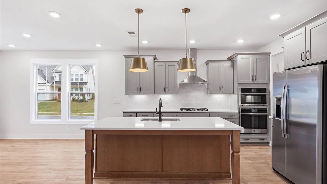 Beautifully appointed kitchen with spacious counters and sophisticated detailing at Fox Hollow
