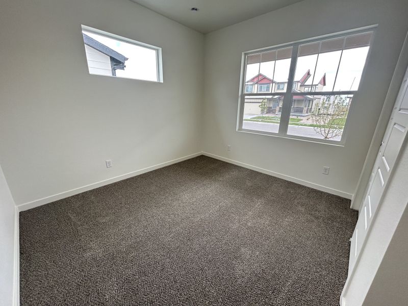 Spacious, unfurnished interior of a new home in Union Colony West, Greeley (Image 25).