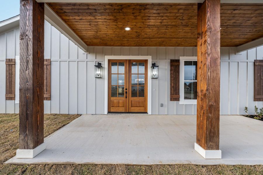 Exterior details and patio area of a home in , New Waverly (Image 32).