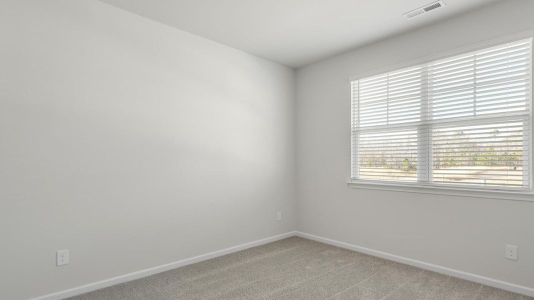 Spacious, unfurnished interior of a new home in Indigo Preserve, Leland (Image 26).