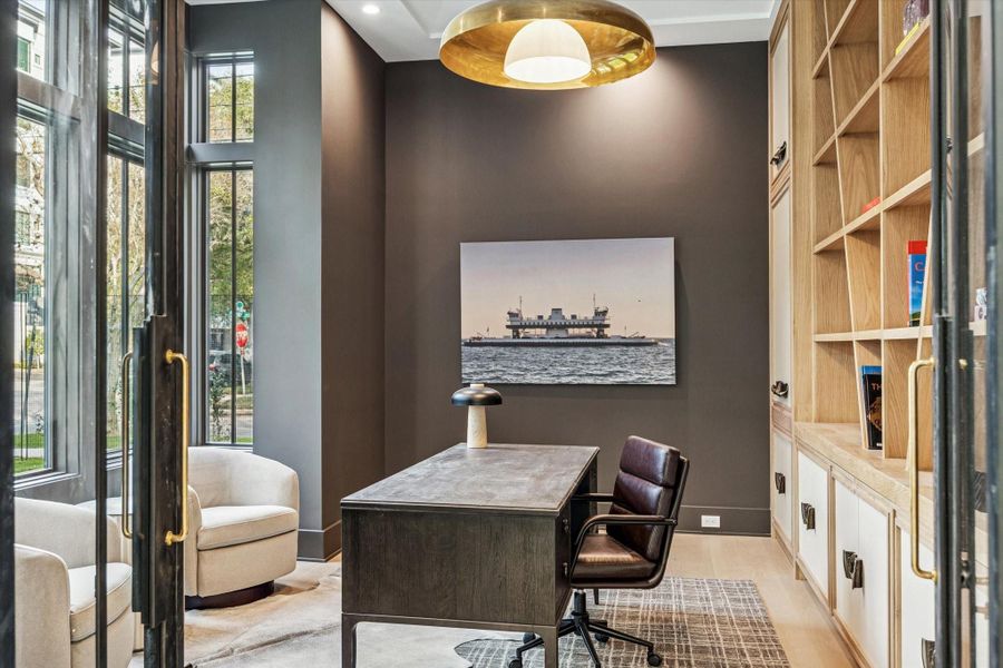 Light-filled study with unique book shelves.