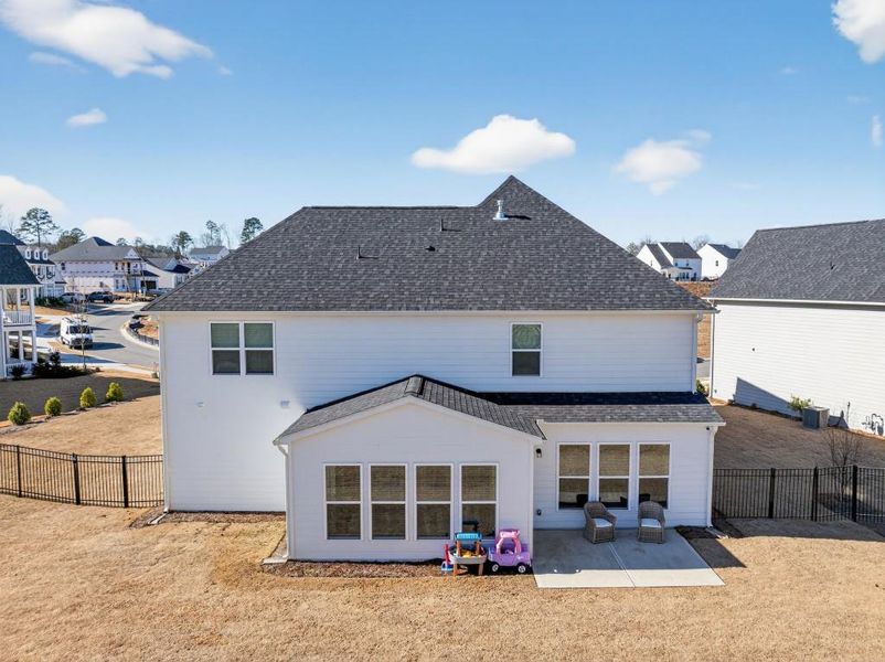 Exterior details and patio area of a home in Reunion, Flowery Branch (Image 30).