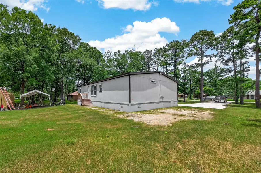 Exterior details and patio area of a home in , Baytown (Image 3).