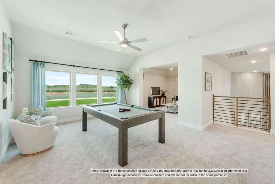 Game room with pool table, vaulted ceiling, ceiling fan, and large windows overlooking a backyard water view Game room with pool table, vaulted ceiling, ceiling fan, and large windows overlooking a backyard water view